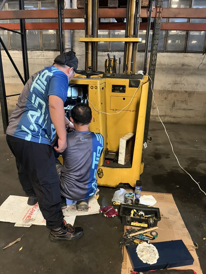 J.A.S team performing forklift preventive maintenance